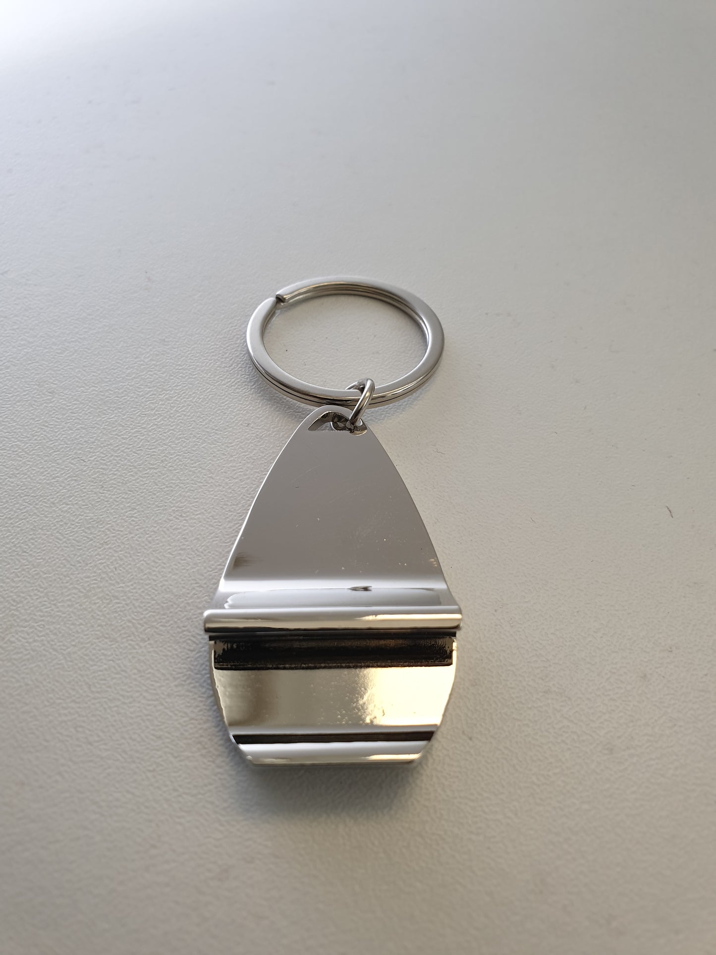 Porte-clés décapsuleur "Jura Geek Store"
