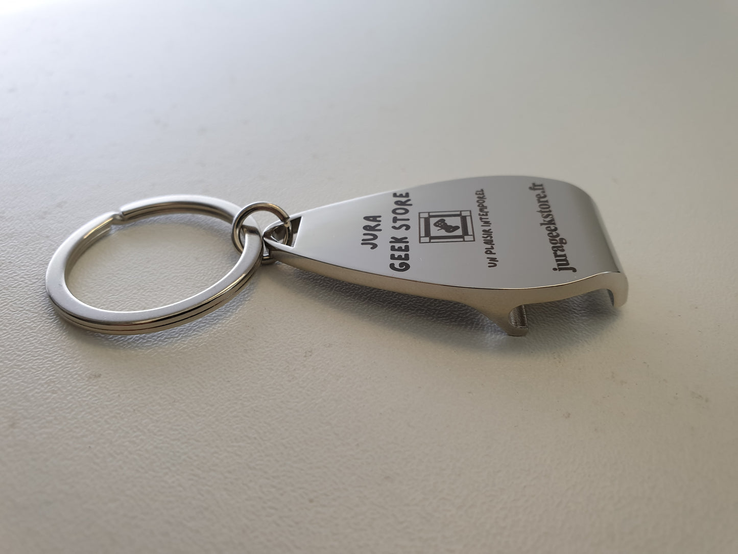Porte-clés décapsuleur "Jura Geek Store"