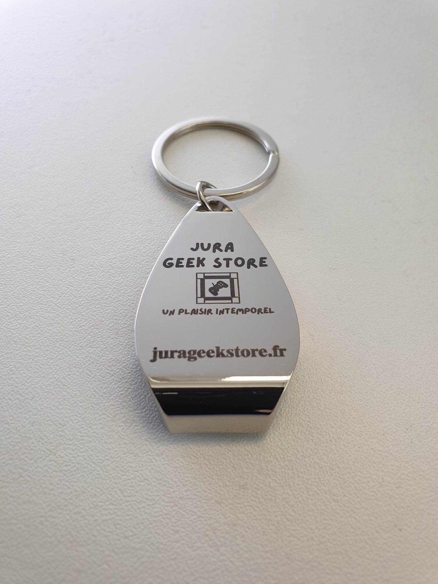 Porte-clés décapsuleur "Jura Geek Store"